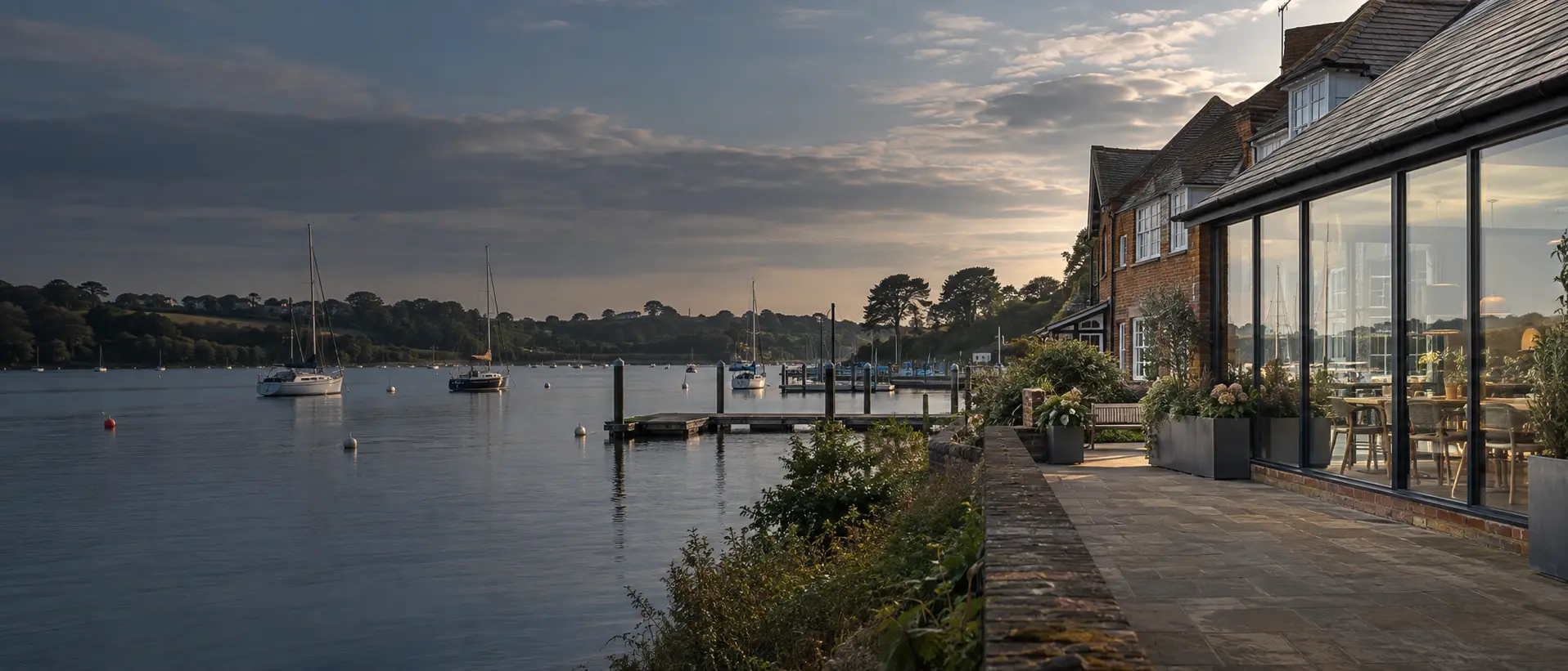 Illustrative waterside business glazing beside the River Hamble in a Warsash-style setting